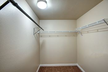 the spacious walk in closet at the preserve apartments at Ellis Court Apartments, Seattle, Washington